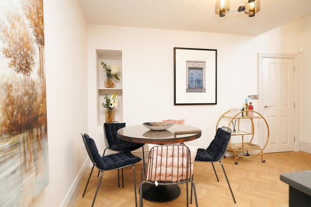 As mentioned before, the dining area is large enough for a big dining table. It is also incredibly bright thanks to the large windows covering the front of the room