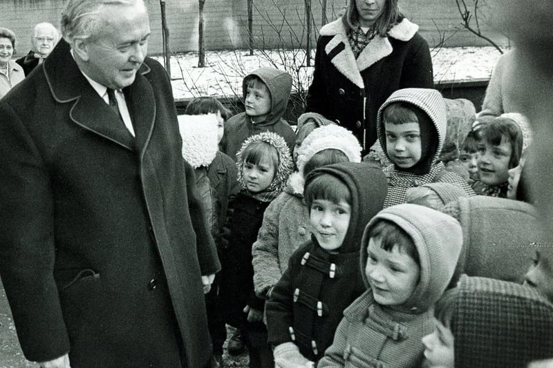 The then Prime Minister Harold Wilson pauses to talk to children from Parkhill Junior and Infants School, outside the Grace Owen Nursery School, Parkhill, in January 1970