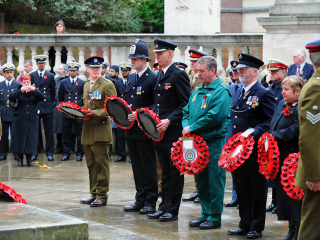 Remembrance Sunday service 2009 at Guildhall Square Portsmouth. Wreaths are prepared to be laid on behalf of civilian services.
Picture: Malcolm Wells (094900-6554)