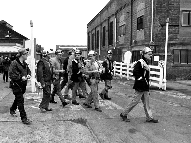 Miners return to work in 1994 as the mine was reopened.