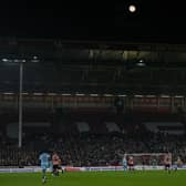 A waning gibbous moon is pictured in the sky during the English FA Cup fourth round-replay football match between Sheffield United and Wrexham at Bramall Lane