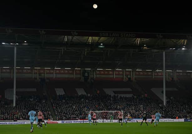 A waning gibbous moon is pictured in the sky during the English FA Cup fourth round-replay football match between Sheffield United and Wrexham at Bramall Lane