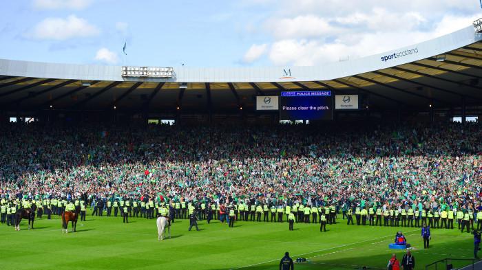 The east end of Hampden was a sea of Hibs fans for the final rendition of Sunshine on Leith after the celebrations and pitch incursions were brought under control. Picture: SNS