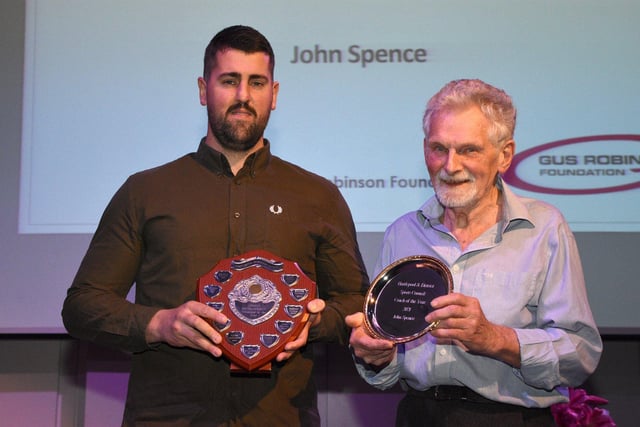 John Spence, left, is presented his Coach of the Year Award by Bob Clouston.
