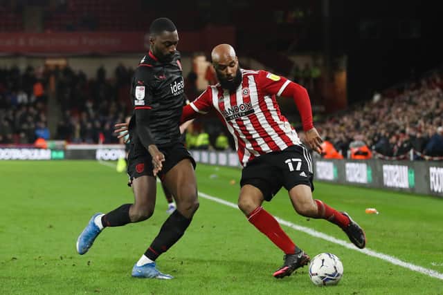 David McGoldrick of Sheffield Utd (right) and Semi Ajayi of West Bromwich Albion battle for the ball during the Sky Bet Championship match at Bramall Lane, Sheffield: Isaac Parkin / Sportimage