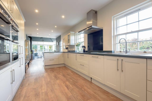 The large kitchen area benefits from a good range of fitted units and stylish fixtures and fittings