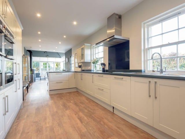 The large kitchen area benefits from a good range of fitted units and stylish fixtures and fittings