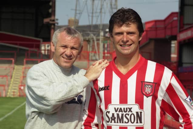Niall Quinn signs for Sunderland. The Echo's picture captain from that day: "Niall Quinn finally became a Roker player today in £1.3m record deal.  Boss Peter Reid helps the new boy settle in at Roker Park.