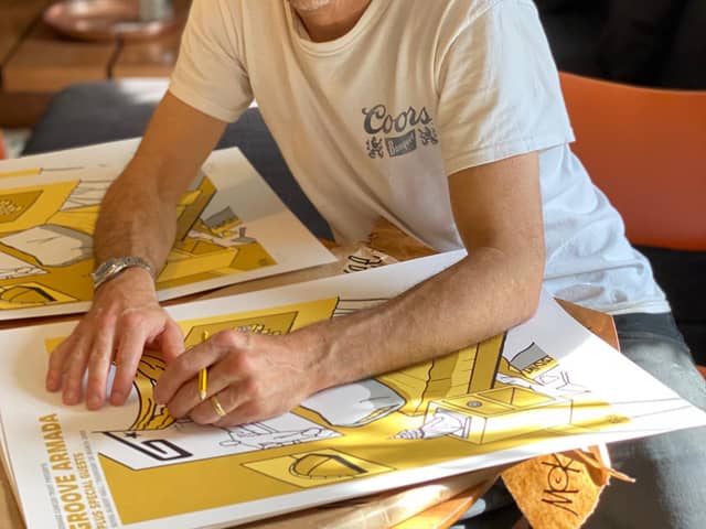 Tom Findlay of Groove Armada signs one of Pete's prints