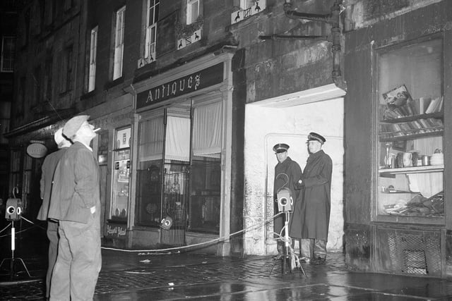 Two policemen guard a Grassmarket tenement in November 1959 after a large crack appeared in the building and residents were evacuated.