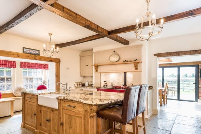 Modern and spacious, with room for an Aga cooker, the kitchen features bespoke handmade fittings, with a central island at its heart that can be used as a breakfast bar.