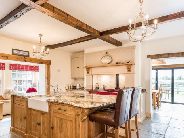 Modern and spacious, with room for an Aga cooker, the kitchen features bespoke handmade fittings, with a central island at its heart that can be used as a breakfast bar.