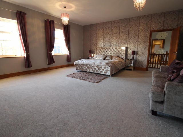 This stunning room is one of five bedrooms in the property