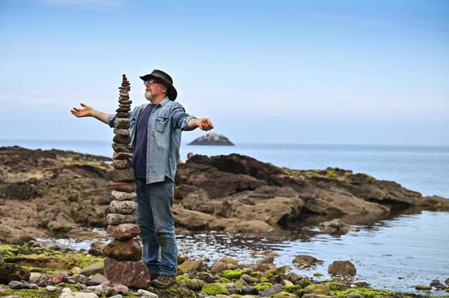 Enthusiasts take part in the European Stone Stacking Championships on July 10, 2021, in Dunbar, Scotland. The championships now in its fifth year, is Europe's largest championships for all Stone Stacking and Rock Balancing enthusiasts and artists. (Photo by Jeff J Mitchell/Getty Images)