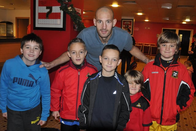 Rob Jones meets young fans at the Junior Rovers Christmas party in 2013