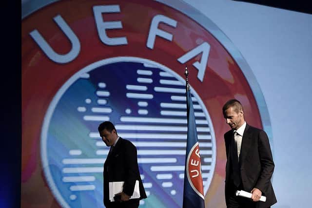 UEFA's President, Slovenian Aleksander Ceferin (R,) could relax his deadline: ARIS MESSINIS/AFP via Getty Images