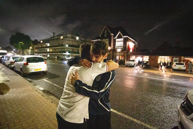 Ben Elliot and Jimmy Gladman console each other outside the Green Posts, Portsmouth. Picture: Habibur Rahman