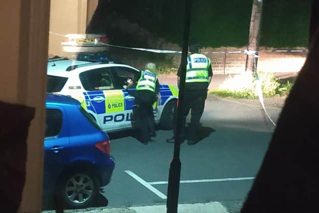 Police at the scene of the gunshot on Myrtle Road last night. Photo: Polly Perkins.