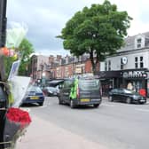 Floral tributes on Ecclesall Road, Sheffield, close to where a female pedestrian was hit by a car driver and later died