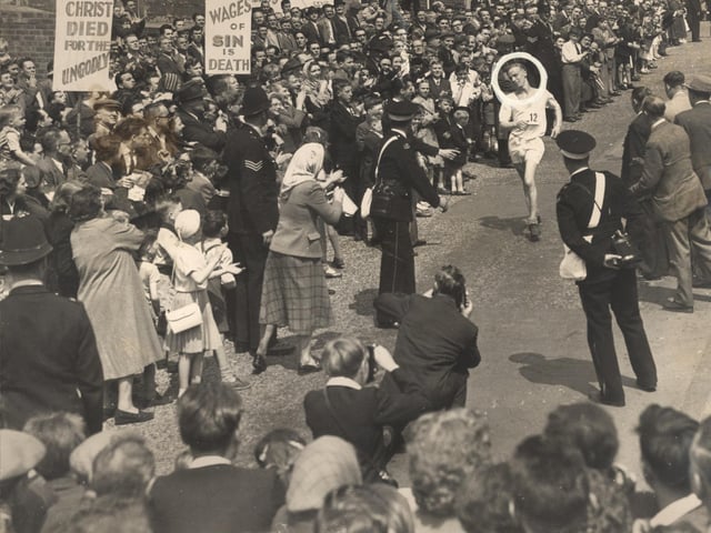 21 year old R.K.Keightley (ringed) wins the 30th annual Star Walk outside Corporation Street May 22nd 1956
