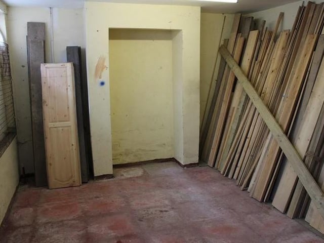 It might not look up to much now, but the lounge is open to plenty of potential. There is a door and window to the front, as well as a tiled floor.