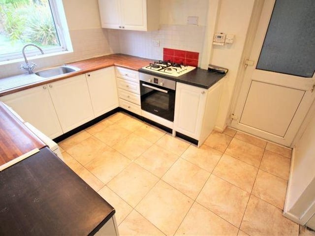 It's not hard to imagine this kitchen getting busy, given that it provides everything you need. It is fitted with a range of wall and base units, incorporating roll-edge work surfaces and a stainless steel sink/drainer with mixer tap. There is also a ceramic tiled floor, radiator, uPVC window to the back and ceiling spotlights.