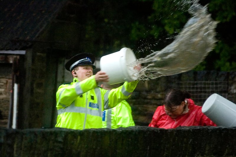 Memories return of 2007 as heavy rains cause more flooding in Sheffield in June 2009. Two houses on Ecclesfield Common were threatened by flood waters from overflowing streams as police officers battled against the waters with buckets and hand shovels