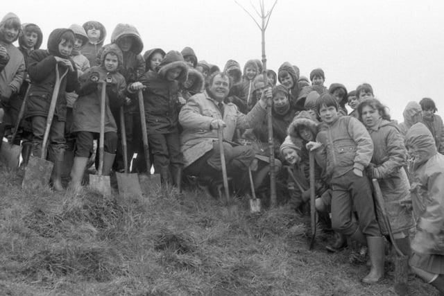 Dozens of schoolchildren armed with spades battled through the rain to plant 700 trees in a day. Youngsters from Garstang County Primary, Garstang St Thomas, St Mary and St Michael schools gathered at the flood basin, along with older children from Garstang High School, to plant the trees with a little hep from the British Trust for Conservation volunteers