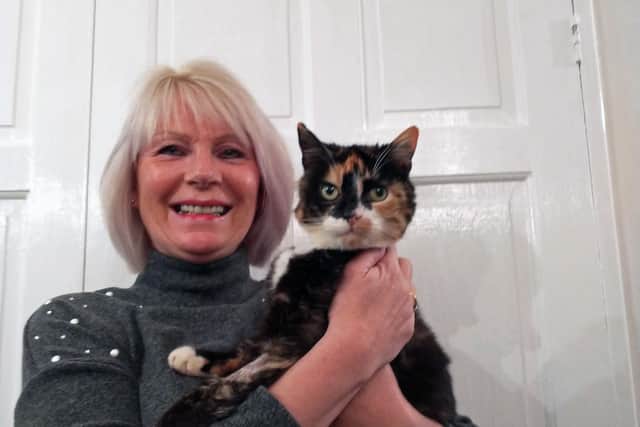 Topsey the cat, back home with owner Alison Jubb in Sheffield