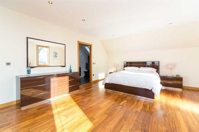 Large and airy master bedroom with a full en suite bathroom