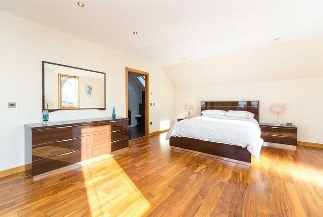Large and airy master bedroom with a full en suite bathroom