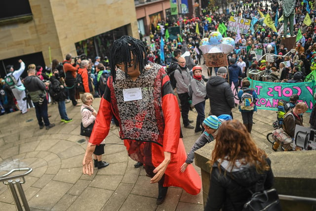 A protester dressed as a character named Displaced Dora during the Extinction Rebellion protest.