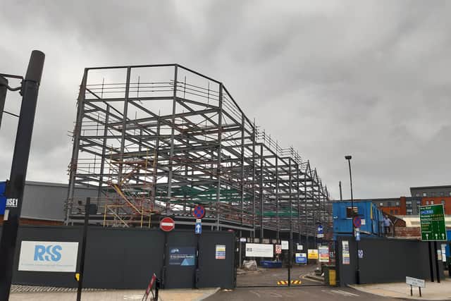 A huge steel frame on the former Atkinson Walker Saws site will become flats beside the Shalesmoor inner ring road.