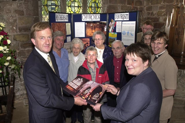 Pictured at  All Saints Church, Aston, where in 2003 the Heritage Lottery Fund announced a grant of  £281,500 to fund the Rotherham Church Tourism Initiative. Seen is  Ian Carstairs Chairman of the Regional Committee of HLF with Sarah Crossland project manager of the RCTI, with  volunteers, and the Vicar of the church Sue Proctor.