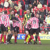 Sheffield United's Patrick Suffo is held back after being sent off during the Battle of the Bramall Lane against West Bromwich Albion in March 2002.