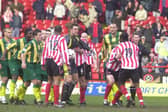 Sheffield United's Patrick Suffo is held back after being sent off during the Battle of the Bramall Lane against West Bromwich Albion in March 2002.