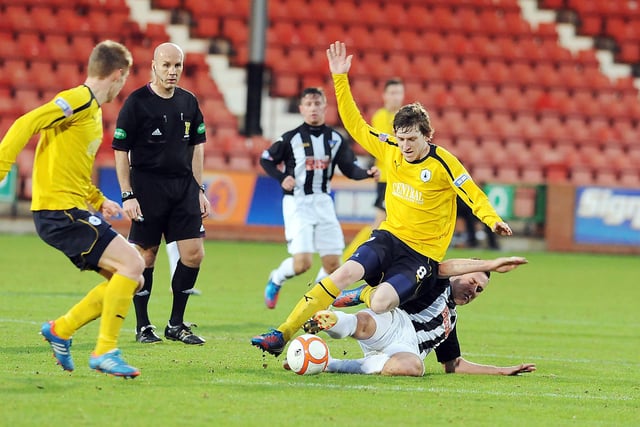 Goalscorer Blair Alston is tackled