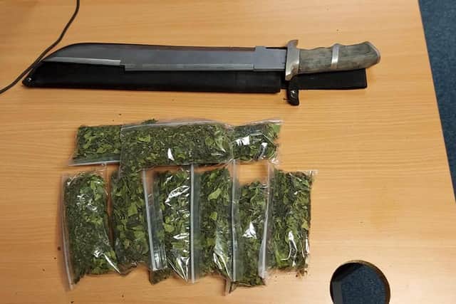 Khat and a large knife were confiscated from the properties.