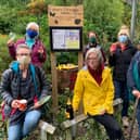 Anne's Community Garden group unveils its new noticeboard, with members Judy Stewart, Gill, Charlotte Forsyth, Nadine Parkinson, Margot Walker, and Kate Halliwell.