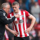 Sheffield United manager Chris Wilder talks to John Lundstram: Catherine Ivill/Getty Images