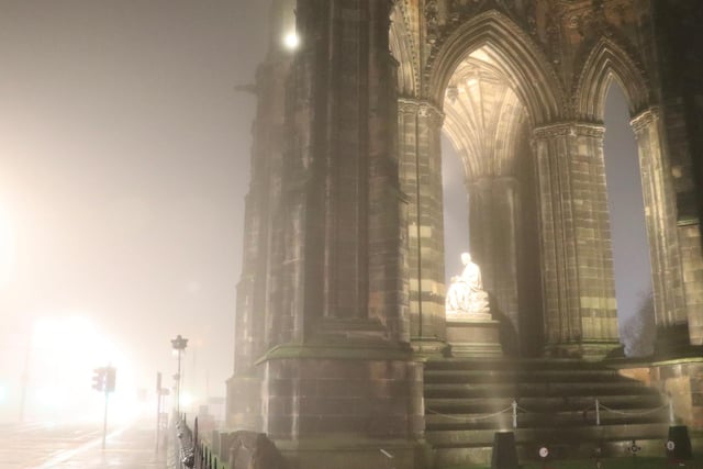 Sir Walter Scott glowing as the fog slowly drifts around Scott Monument in the Capital's Princes Street. The Edinburgh-born novelist and historian almost looks angelic as the light shines down on him amid the misty November night.