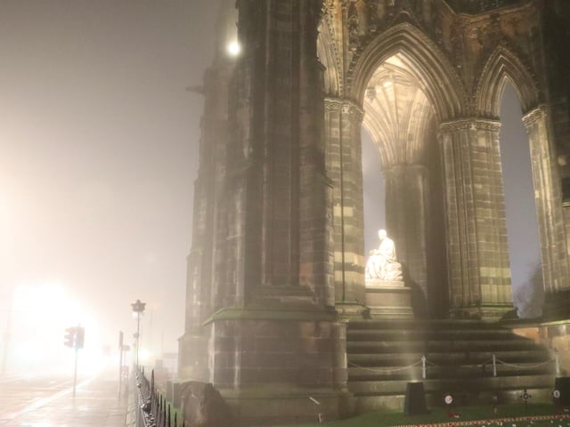 Sir Walter Scott glowing as the fog slowly drifts around Scott Monument in the Capital's Princes Street. The Edinburgh-born novelist and historian almost looks angelic as the light shines down on him amid the misty November night.