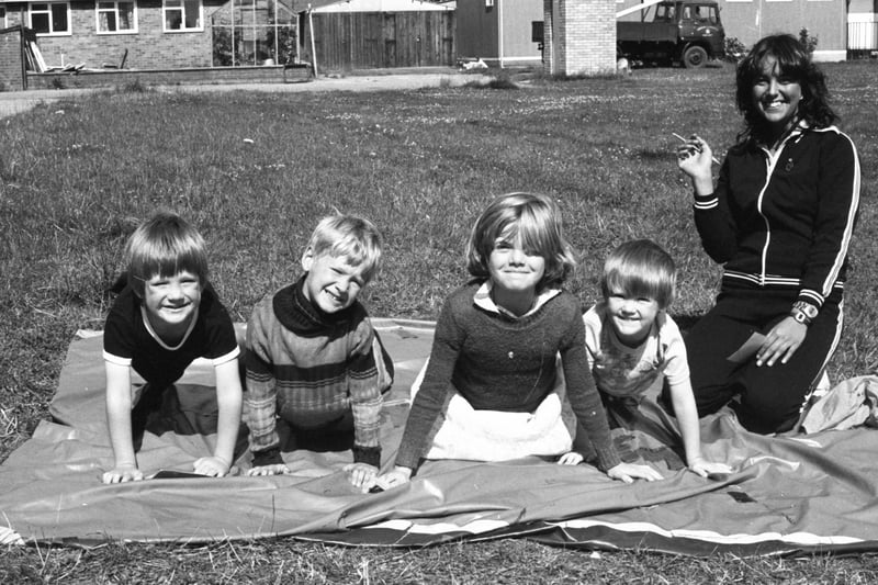 Kt's August 1979 and the sun shone on the Northumbria Police playscheme at Farringdon. Going through their press-ups in a Superstars competition at the play scheme are, left to right:  Billy Eynon, John Burnicle, Patricia Gibson and Richard Eynon, with Jacqueline Simm doing the scoring.