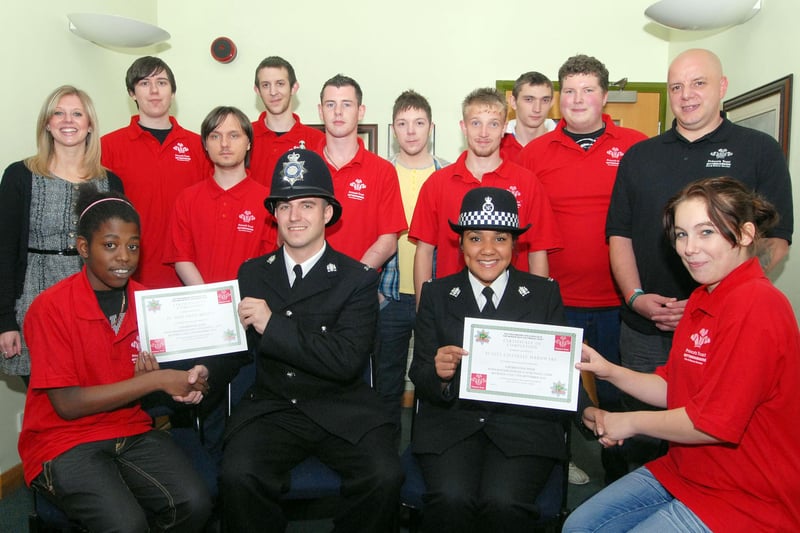 Police officers Adam Brown and Chanelle Hardware are presented with certificates to mark their work with members of the Princes Trust by Stacey Harris, left, and Natasha Rees.