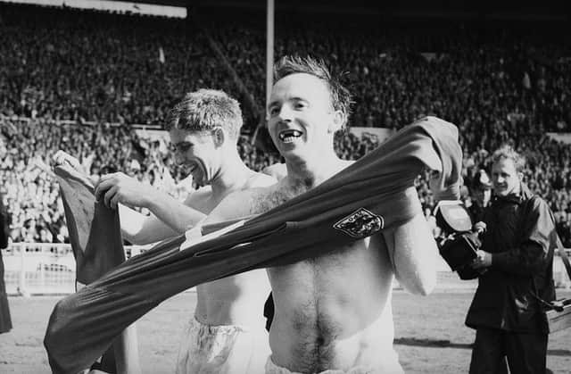 Teammates Alan Ball, left, and Nobby Stiles celebrate after England's victory in the 1966 World Cup final at Wembley, 30th July 1966. (Photo by Evening Standard/Hulton Archive/Getty Images)