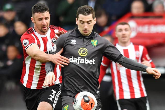 Sheffield United's Enda Stevens (left) and Norwich City's Kenny McLean battle for the ball during the Premier League match at Bramall Lane, Sheffield: Anthony Devlin/PA Wire.