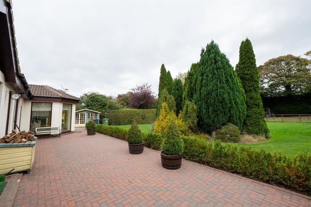 To the rear of the property is a stunning mature well stocked garden boasting an array of plants, trees and shrubs in addition to a generous block paved patio and lawns.