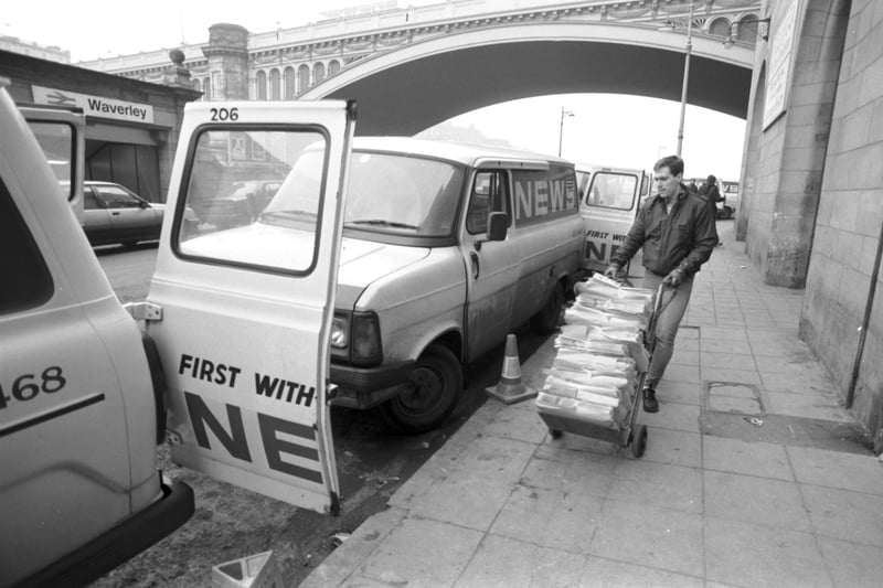 A Scotsman Publications employee loads copies of the Evening News newspaper into delivery vans in Market Street Edinburgh, December 1987.