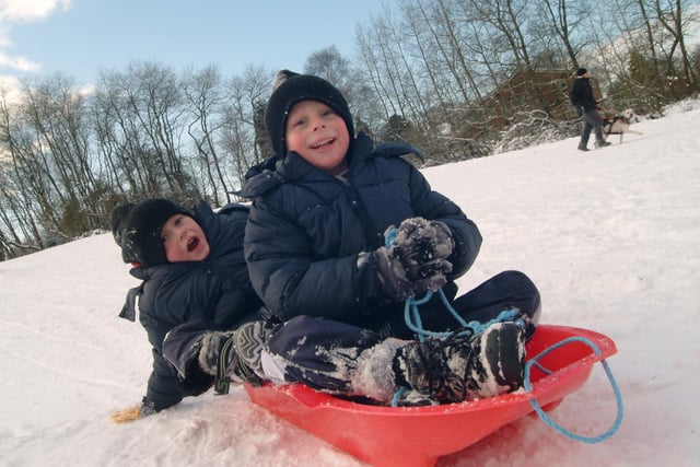 Best friends Daniel Brown and Jack Shipman, both 6, from Sutton playing in the snow on Sutton Lawn in January 2010.