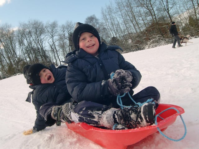 Best friends Daniel Brown and Jack Shipman, both 6, from Sutton playing in the snow on Sutton Lawn in January 2010.